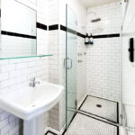 Private bathroom at Darlo Bar double room with tiled walk-in shower and pedestal basin.