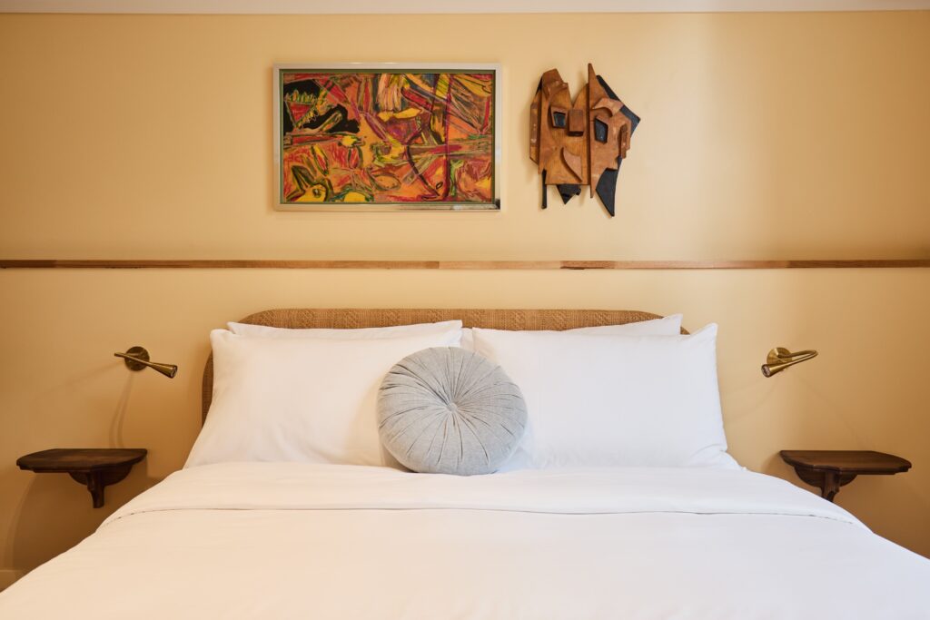 Double room at Darlo Bar accommodation in Darlinghurst, Sydney, with queen bed, artwork and natural light.
