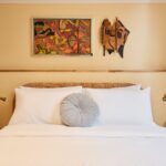 Double room at Darlo Bar accommodation in Darlinghurst, Sydney, with queen bed, artwork and natural light.